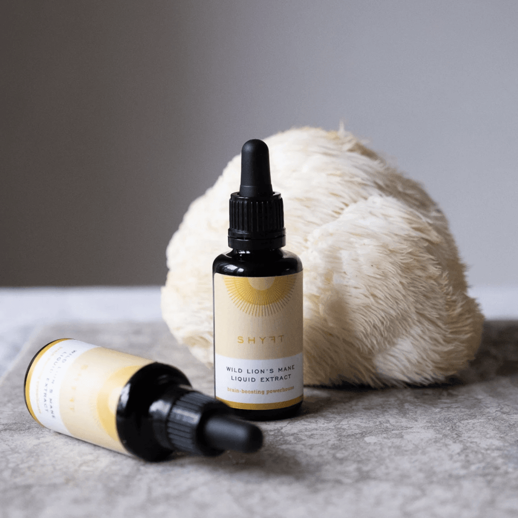 Lion’s Mane mushroom extraction next to a real Lion's Mane mushroom, illustrating an easy way to incorporate it into daily life.